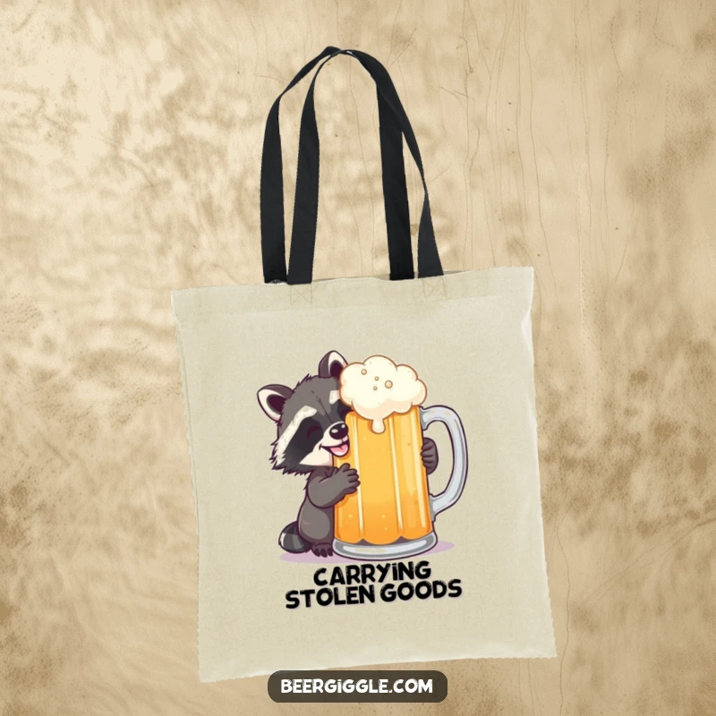 Funny raccoon grinning while sneaking a sip of beer from a large mug, depicted on a tote bag for a humorous vibe.